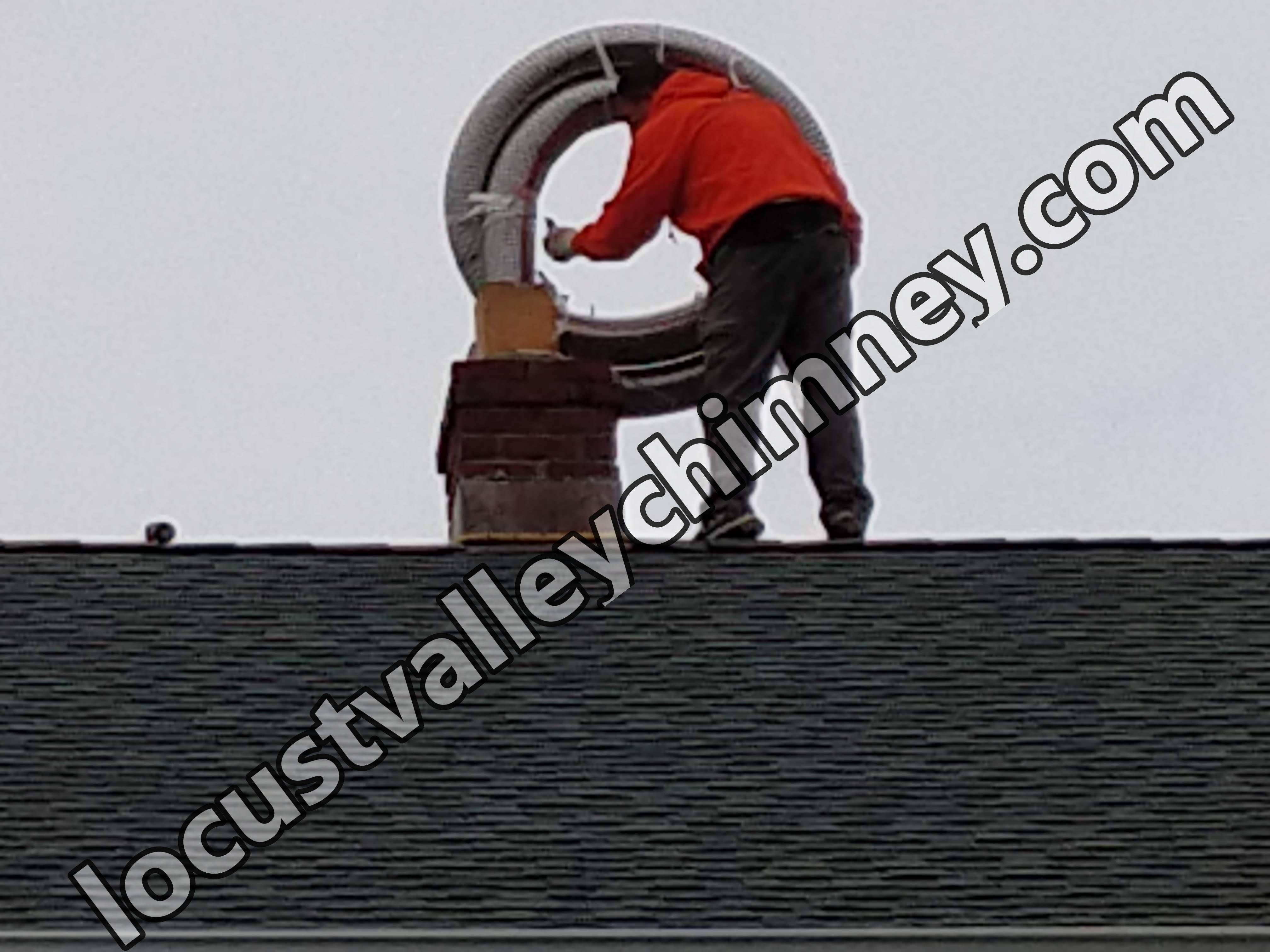 Flexible stainless chimney liner being installed in Lattingtown, New York