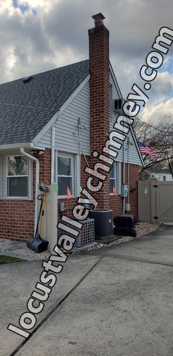 Professional chimney repointing restoring brick joints in Locust Valley, NY